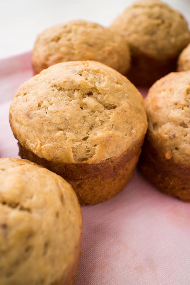 EASY Moist Banana Muffins Recipe made with yogurt! These healthy muffins only need 2 tablespoons of butter and 1/4 cup brown sugar!   My entire family thinks these are the best muffins for breakfast and dessert!