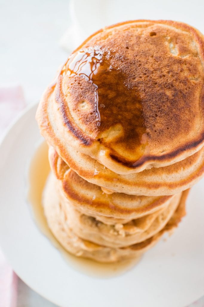 stack of pancakes with syrup on them.