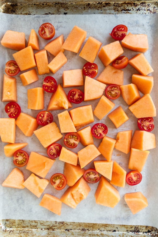 Healthy Roasted Cantaloupe Salad recipe made in 30 minutes.  It's an easy savory and sweet melon tomato salad! I love this recipe for our garden Summer fruit!  This salad is vegetarian, vegan and gluten free. 