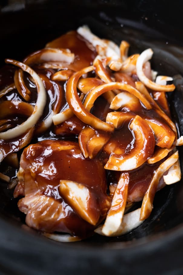 BBQ Slow Cooker Chicken Thighs recipe that my family loves!  Throw these boneless chicken thighs in the crockpot for 2 and a half hours and then serve over rice for a easy complete meal! Keto and low carb recipe. 