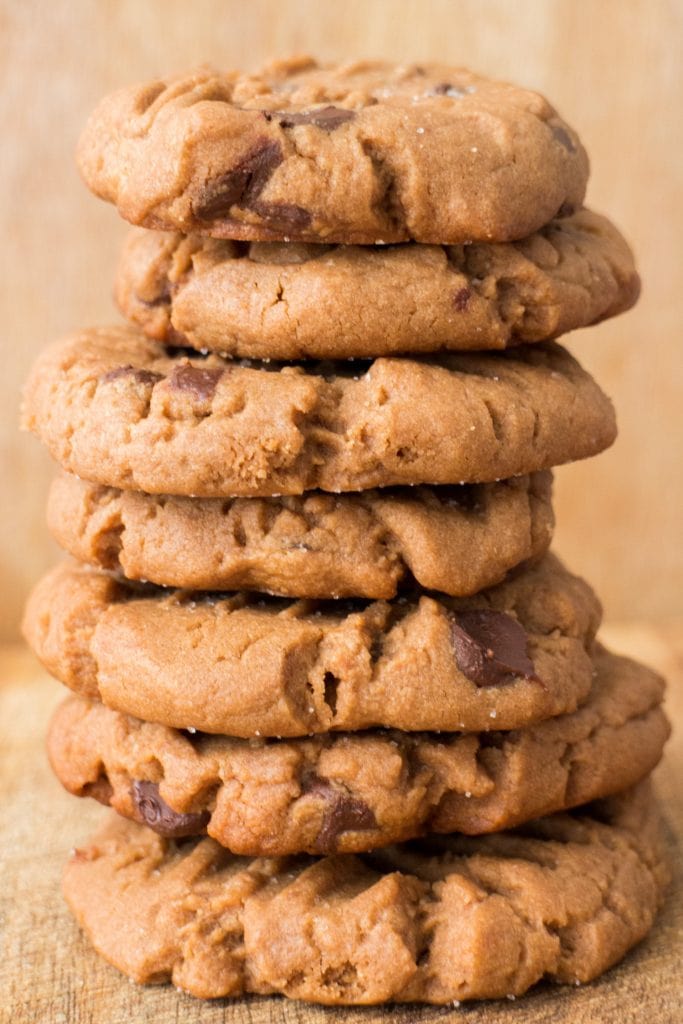 stack of chocolate chip peanut butter cookies on table. 