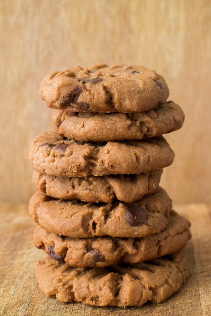 stack of chocolate chip peanut butter cookies on table.
