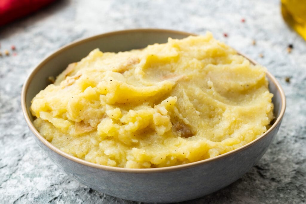 mashed potatoes in white bowl.