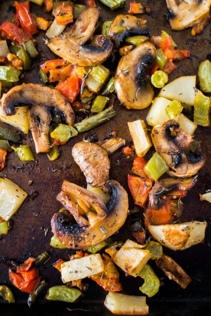 closeup of roasted vegetables on baking sheet out of the oven.