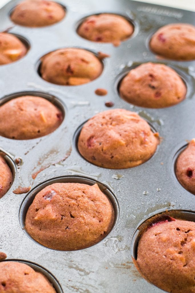 mini muffin pan with baked muffins in it.