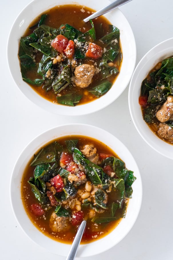 Italian Sausage Soup with collard greens, white beans and diced tomatoes. Your entire family is going to love this easy to make hearty soup, and even better it's only 180 calories a serving!  This creamy soup is dairy free, keto and low carb. 