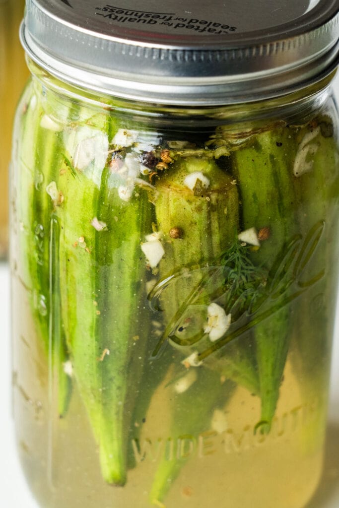 pickled okra in mason jar.
