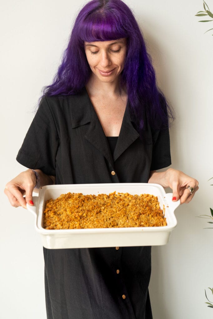 pamela reed, brooklyn farm girl, holding carrot casserole in baking dish.