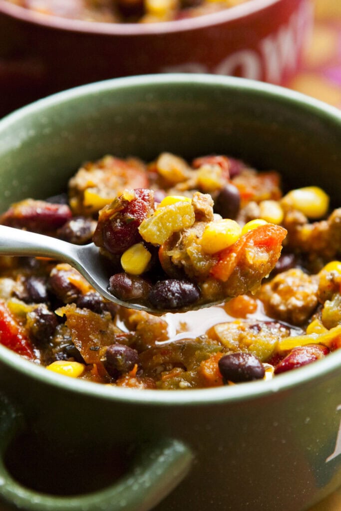 pumpkin chili with spoon in bowl. 