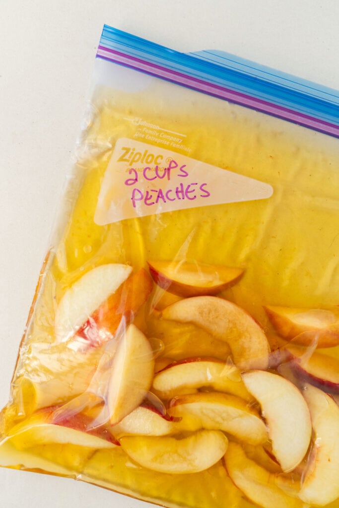 frozen peaches in freezer bag.