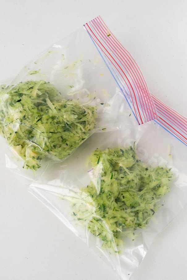 Easy step by step instructions on how to freeze zucchini without needing to blanch it. This quick method saves you time and freezes zucchini for up to a year. Perfect for making zucchini bread and treats with!