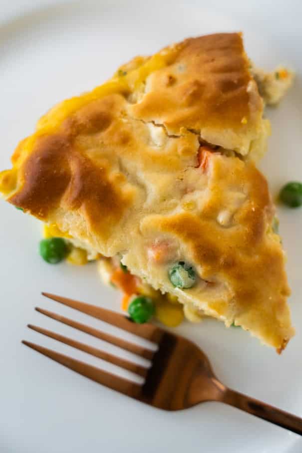 This recipe for easy chicken pot pie is a creamy mixture of chicken, vegetables and mushroom soup that is topped with a Bisquick flaky crust and baked to a golden brown perfection.