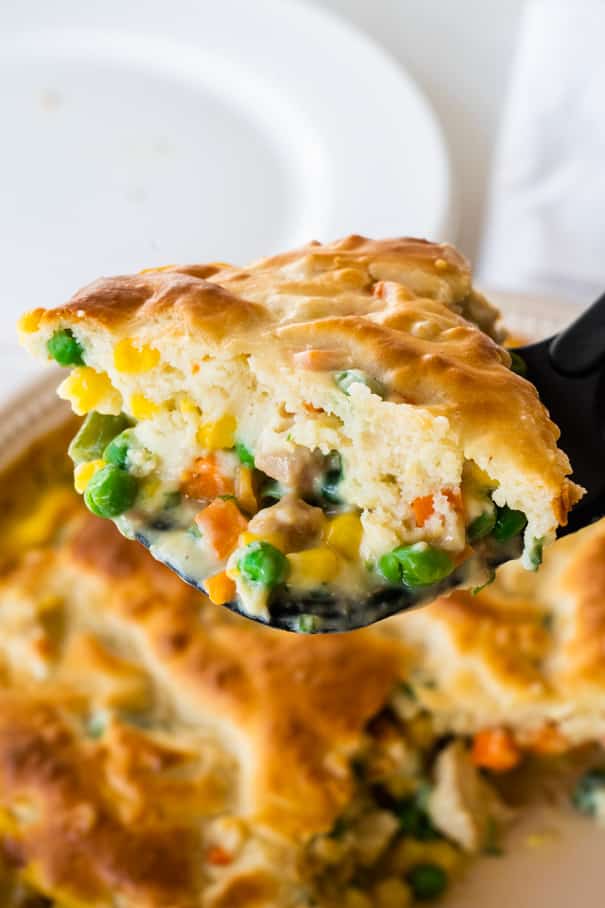 This recipe for easy chicken pot pie is a creamy mixture of chicken, vegetables and mushroom soup that is topped with a Bisquick flaky crust and baked to a golden brown perfection.