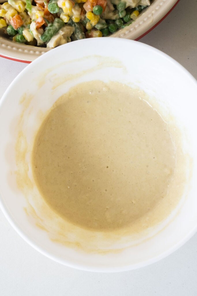 bisquick pie crust mixture mixed in white bowl. 