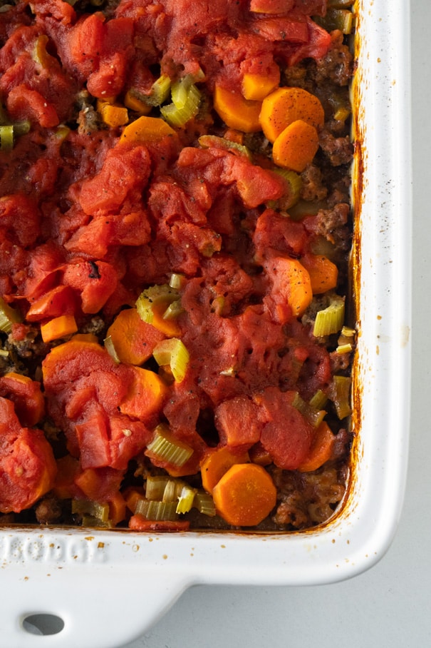 This ground beef casserole or commonly called Shipwreck Casserole is a comfort food meal that always gets rave reviews. This super easy version of the classic Shipwreck Casserole is made with ground beef, rice, potatoes and lots of veggies, baked together in the most delicious tomato sauce. This dinner is quick to throw together, and it freezes well too. This beef casserole is one of my favorite cozy winter meals!