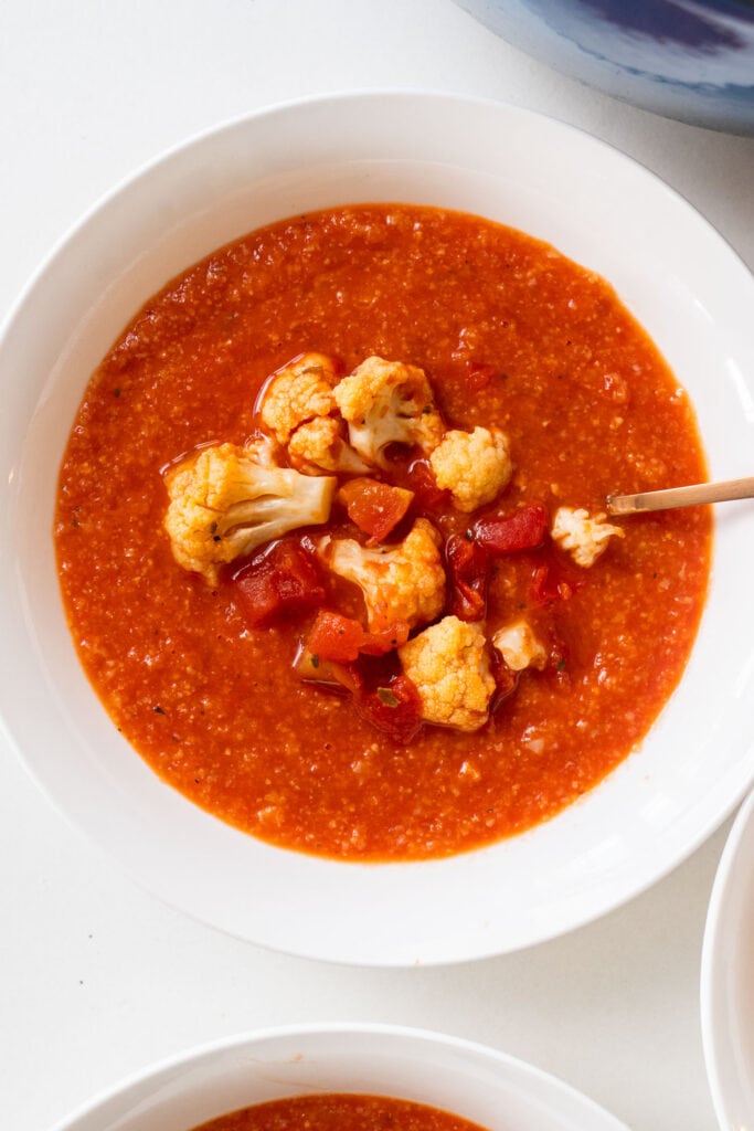 bowl filled with tomato cauliflower soup.