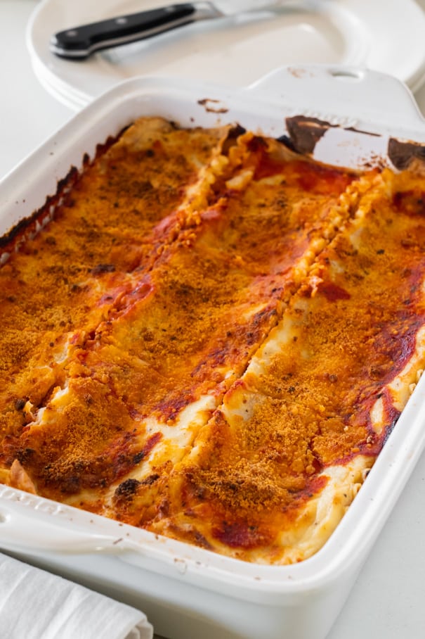 This white sauce lasagna recipe is one of our favorite comfort foods. Lasagna noodles are layered with spaghetti sauce, cheese, and a rich creamy alfredo inspired sauce. Serve it alongside a simple kale salad and garlic bread for a comfort meal that’s perfect for any time of the year!