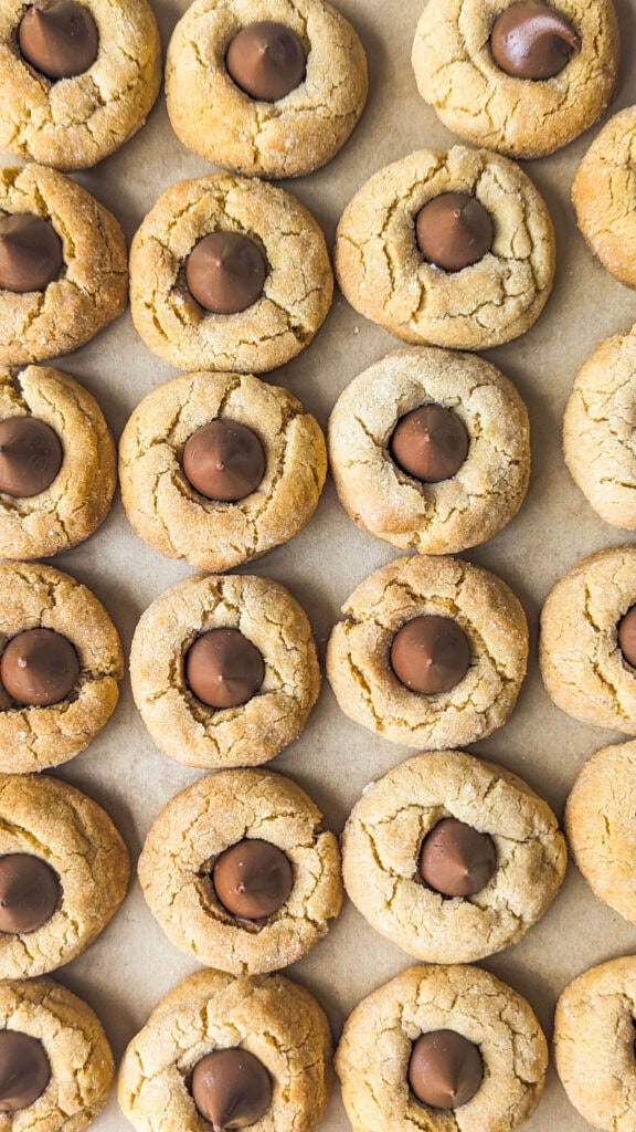 Peanut Butter Blossoms on parchment paper.