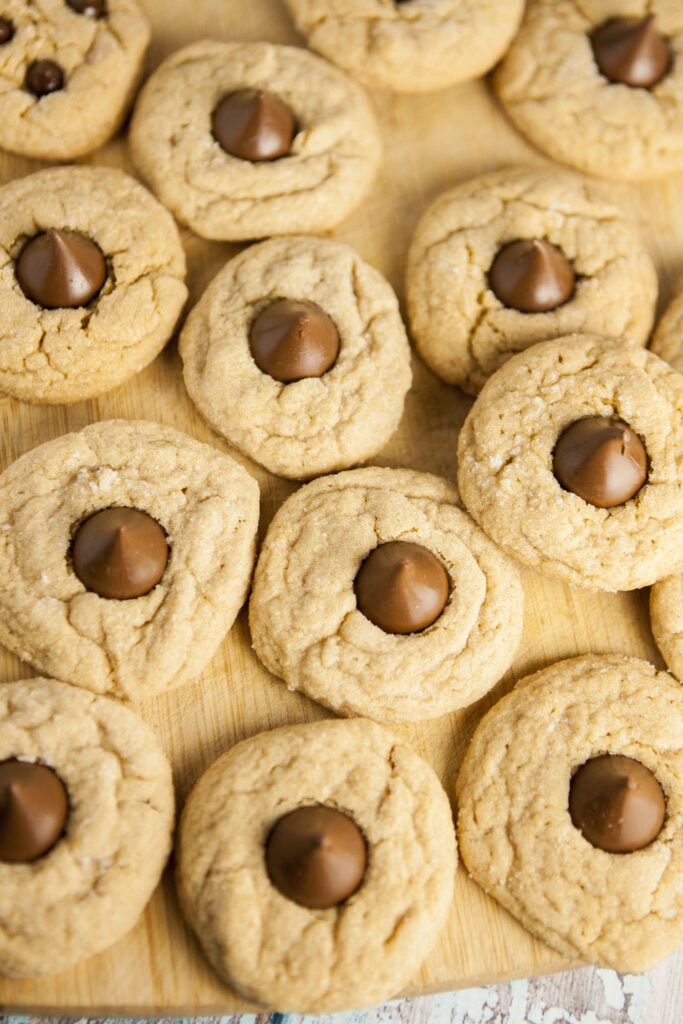 peanut butter blossom cookies on cutting board.