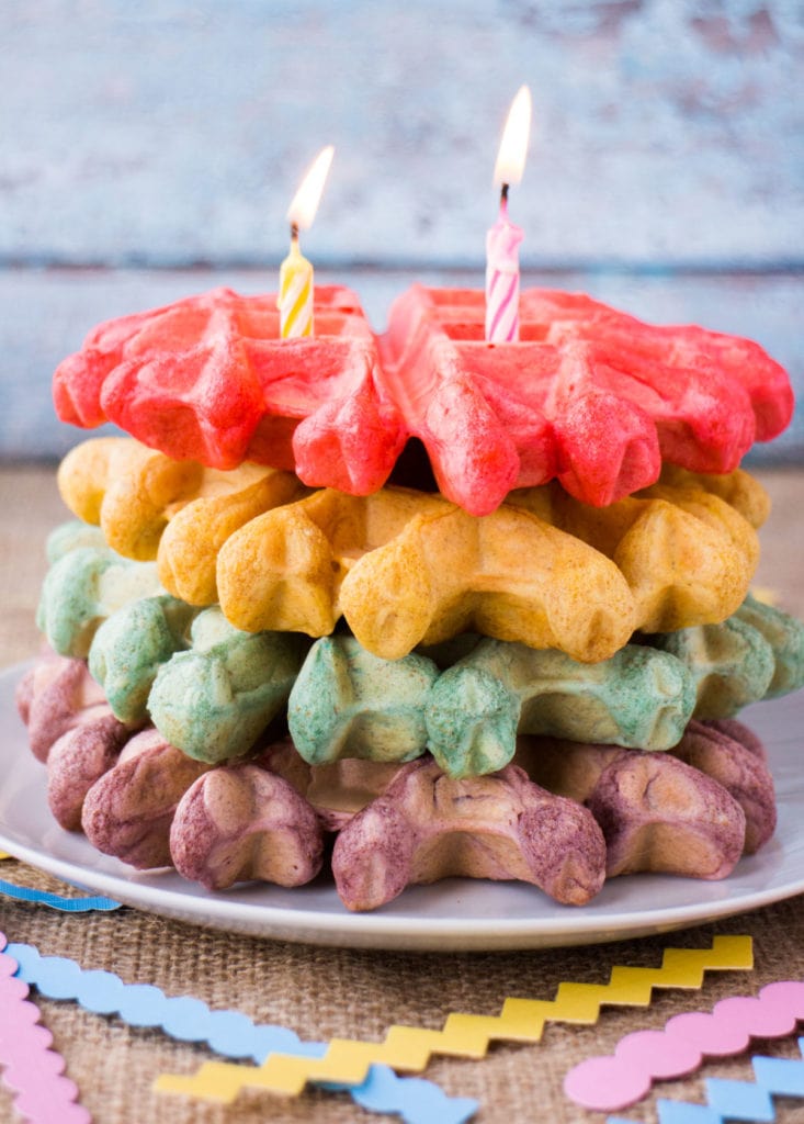 Big FLUFFY Belgian Rainbow Waffles are easy to make, taste delicious and will make any celebration even more special! This rainbow waffle recipe is the perfect birthday breakfast in bed and a good one to serve up on St. Patrick’s Day (or any day)!