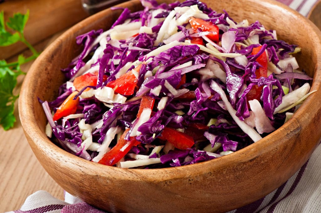 Easy healthy Red Cabbage Salad with red peppers and onions.  Homemade dressing is made with apple cider vinegar, lemon juice and olive oil.  Delicious clean eating salad! 