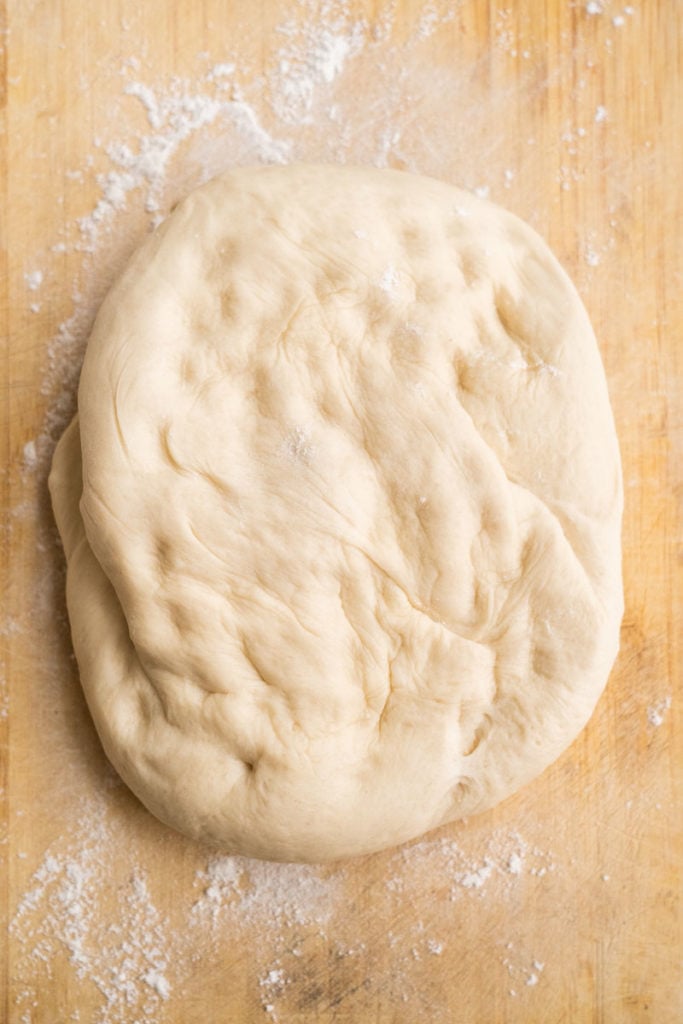 dough kneaded out on floured surface