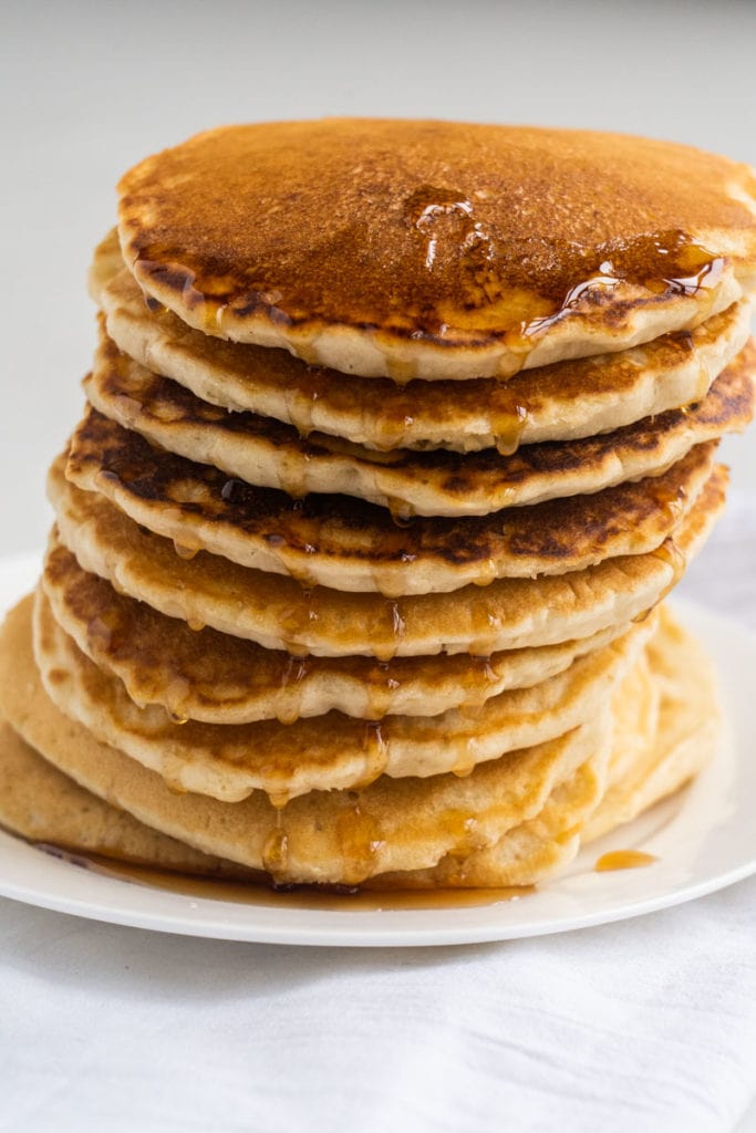 Easy fluffy pancakes that are made with no milk and no eggs.  This homemade recipe is made with simple pantry ingredients and water. 