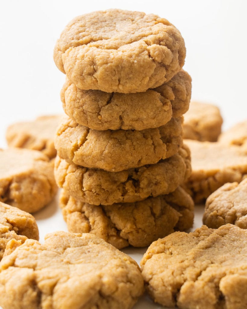 Easy peanut butter cookies recipe made with no flour.  These simple chewy cookies are made with only 4 ingredients!   These are one of my family's favorite cookies and I love how quick they are to make!  