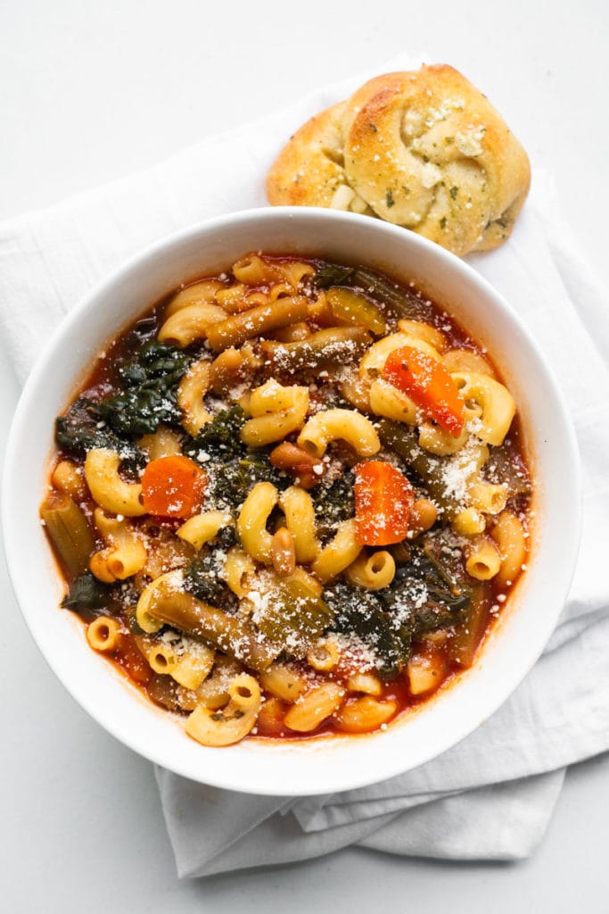 minestrone soup served with garlic knot rolls