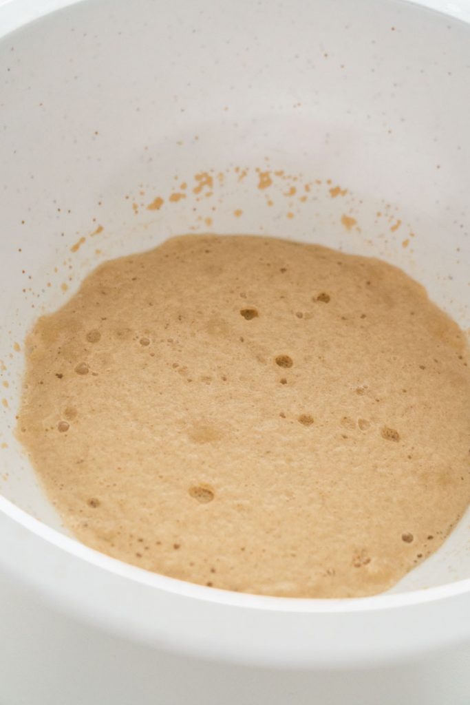foamy yeast in white bowl