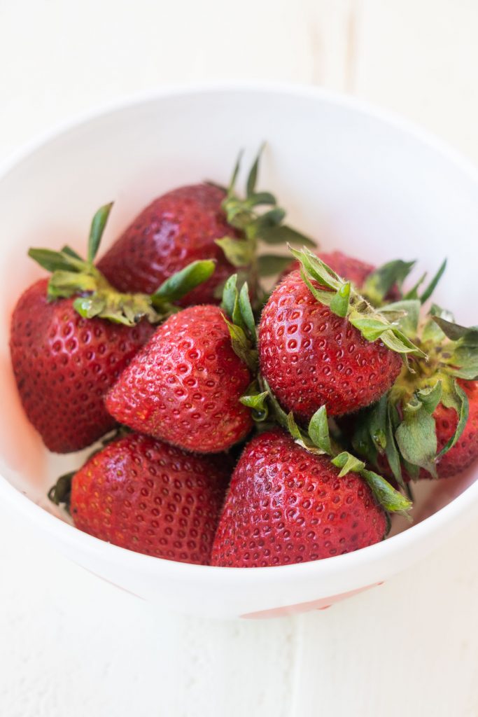 fresh strawberries in white bowl