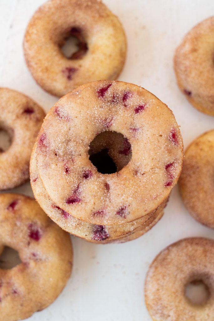 baked strawberry donuts on white table