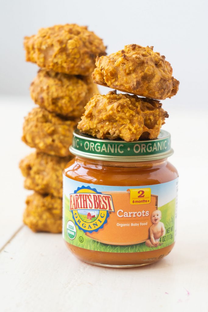 carrot baby cookies with jar of carrot baby food on white table