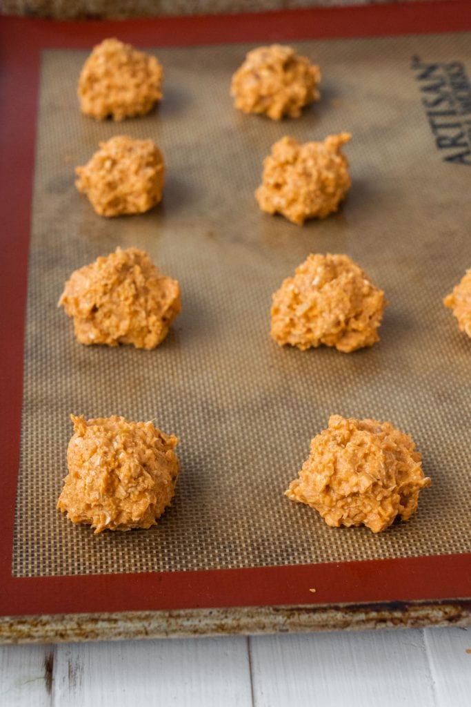 carrot cookies on silicone baking mat ready to go into the oven