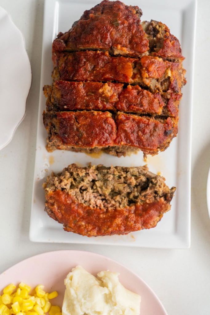 cheesy meatloaf cut up into slices