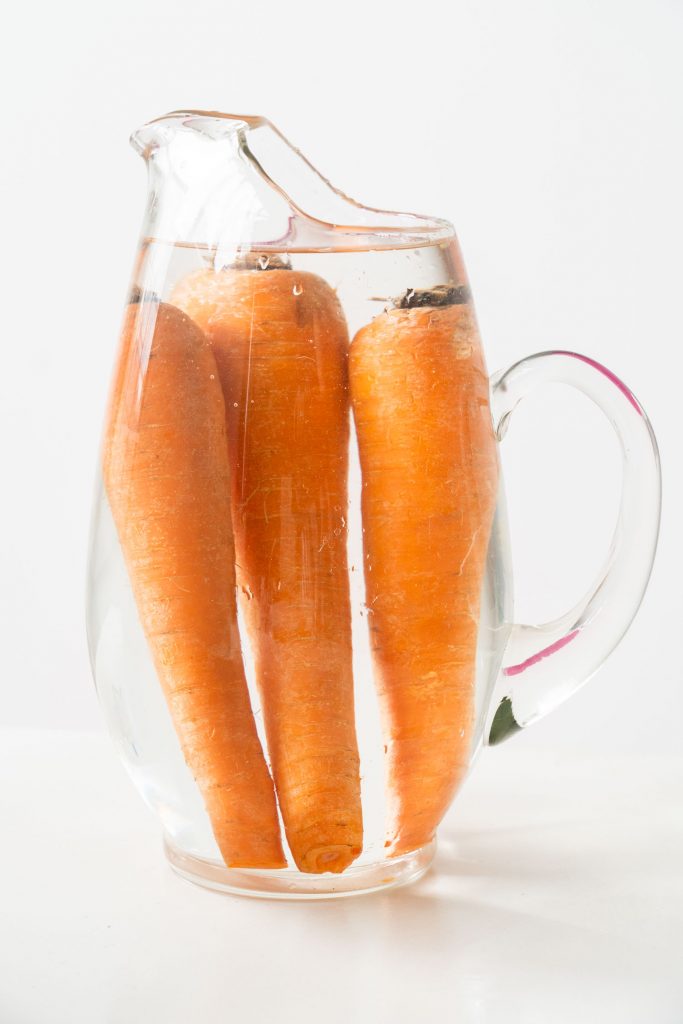 storing carrots in pitcher covered with water