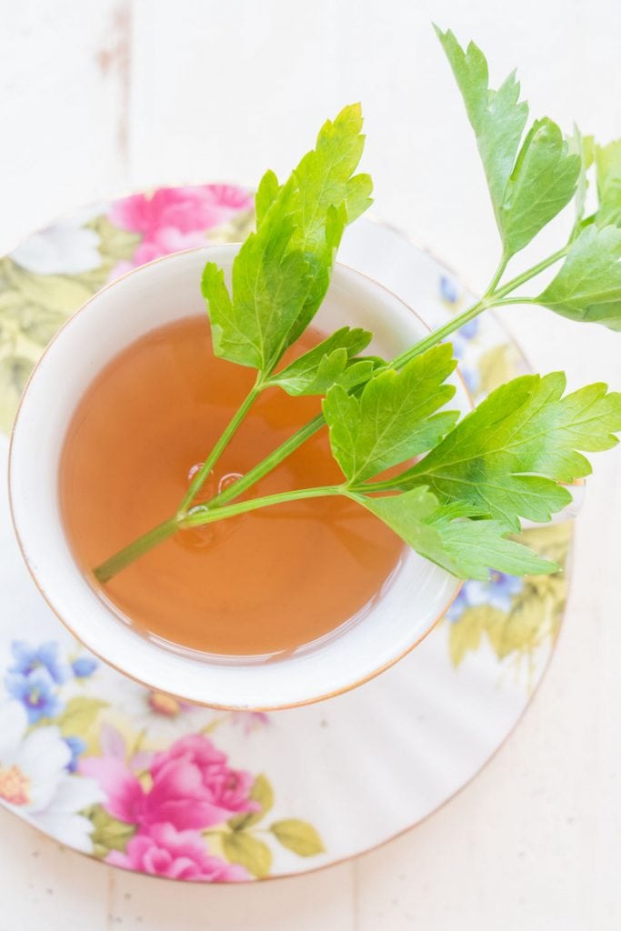 fresh parsley tea in floral tea cup