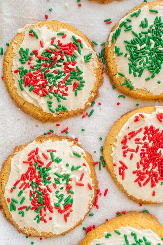 cookies with red and green christmas sprinkles on white background