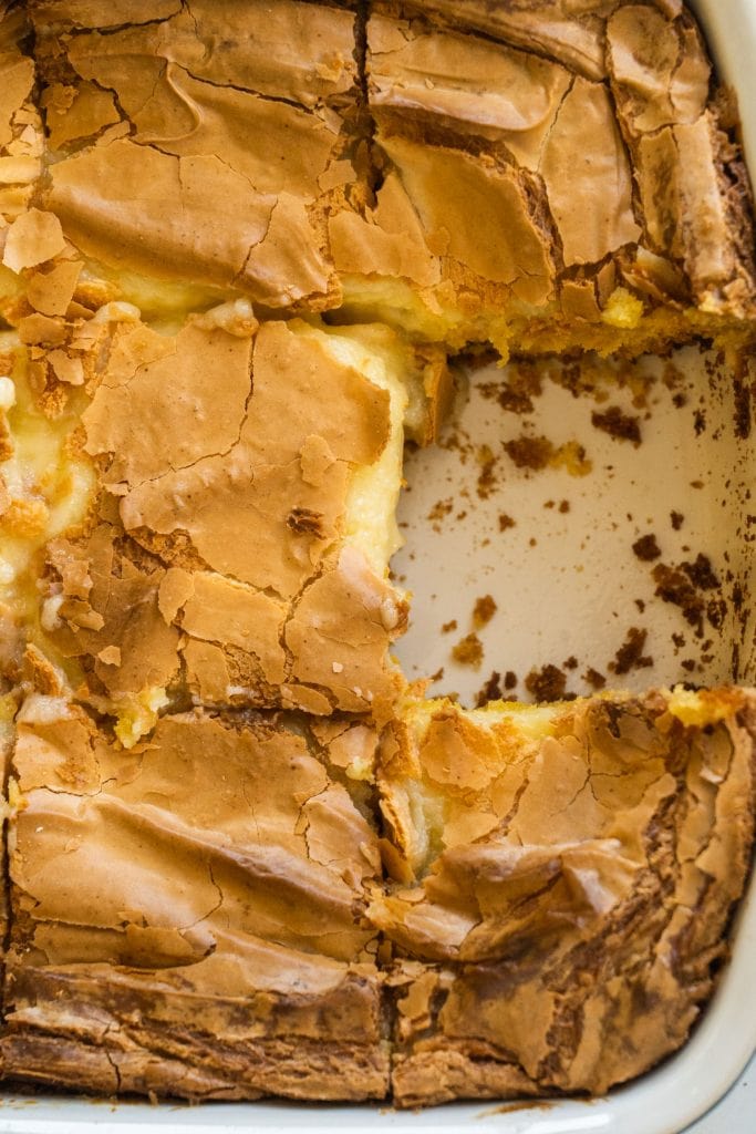 baking dish filled with butter cake with one slice missing