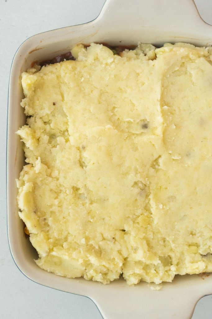 mashed potatoes added on top in baking dish