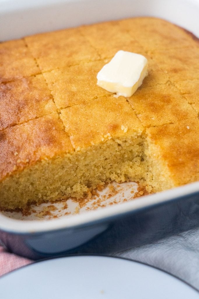 baking dish with cornbread with pieces missing