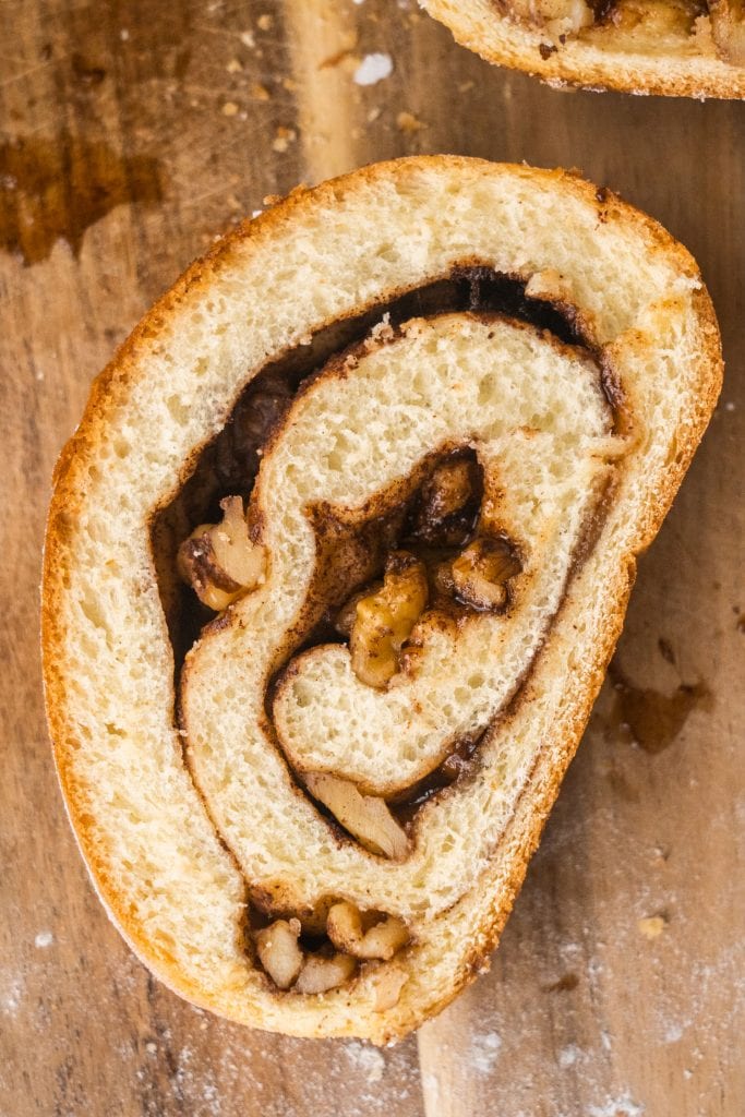 slice of cinnamon swirl bread with gooey cinnamon sugar inside