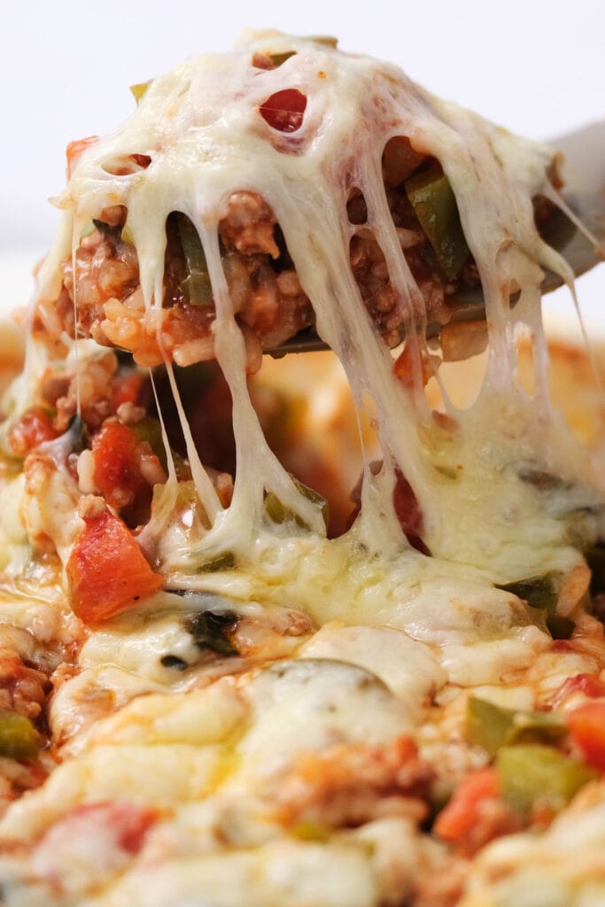 closeup of unstuffed bell pepper casserole with cheesy mozzarella on top.