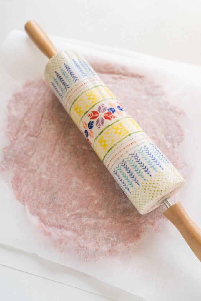 rolling pin on parchment paper