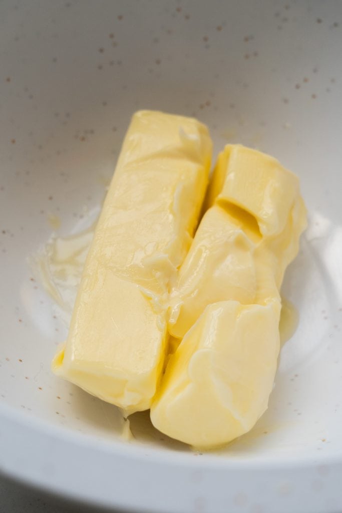 2 sticks of softened butter in bowl.