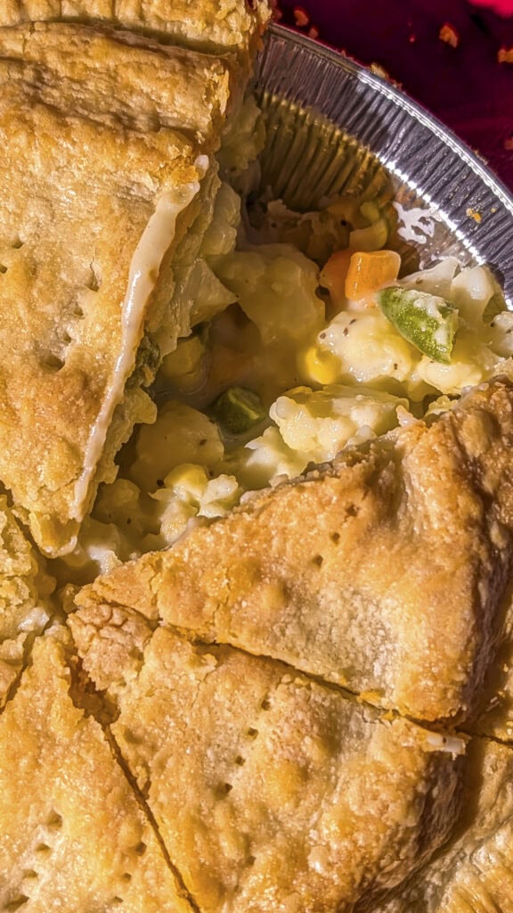 vegetable pot pie with slice missing.