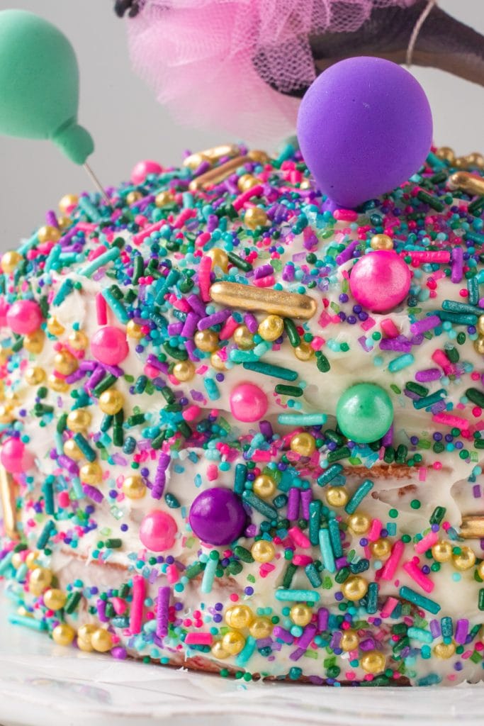 closeup of cake with sprinkles on over it.