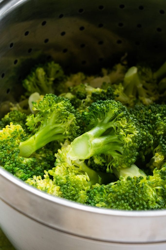 broccoli cooked in strainer.