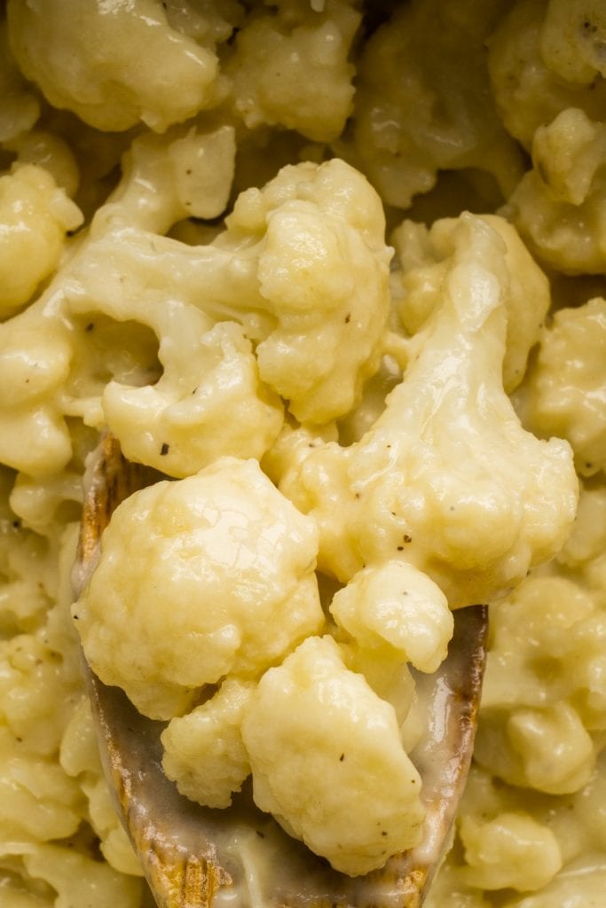 spoon serving cheesy cauliflower. 