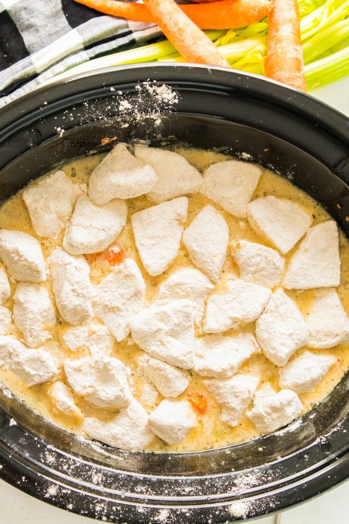 biscuits added into slow cooker on top.